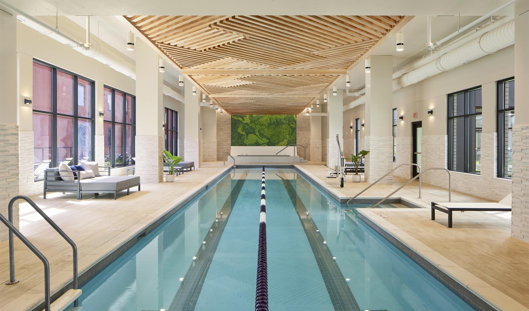 Relax and unwind poolside a swimming pool in a house