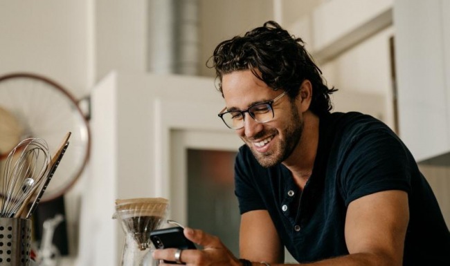 Settle into comfort at 240 Park a man holding a phone