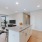 a kitchen with white cabinets
