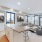 a modern looking living room with a large glass table and a large window