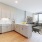 a kitchen with white cabinets