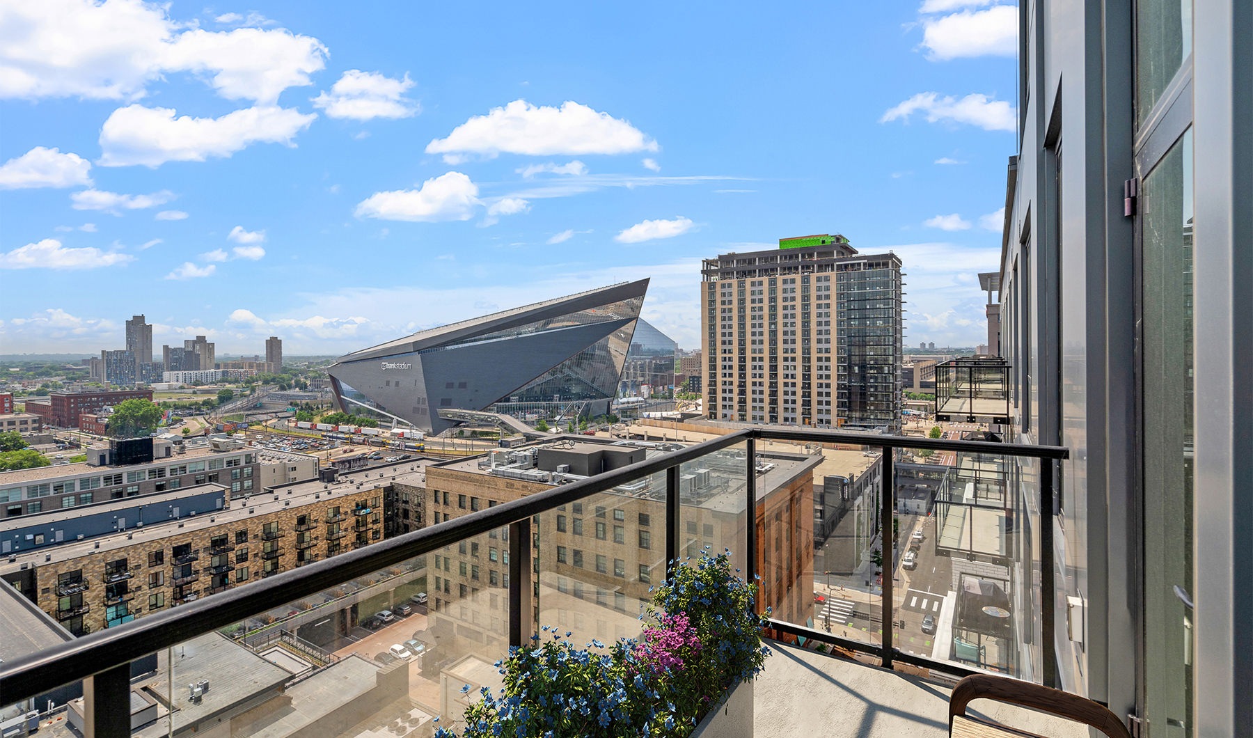 Experience Elevated Downtown Living a view of a city from a balcony